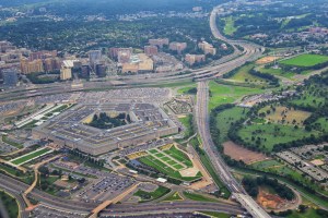 Aerial view of the United States Pentagon, the Department of Defense headquarters in Arlington, Virginia, near Washington DC, with I-395 freeway and the Air Force Memorial and Arlington Cemetery nearby.